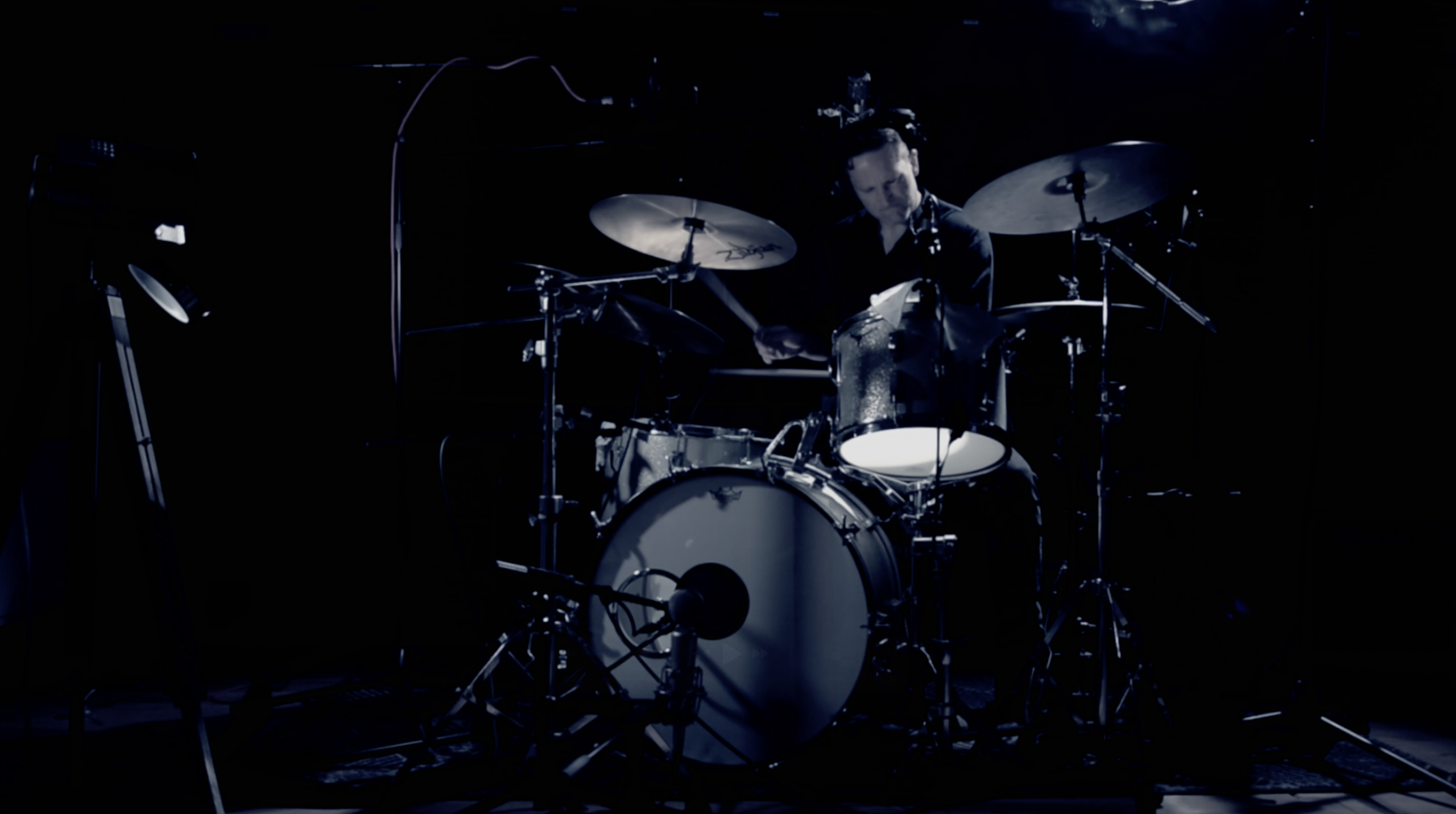 best session drummer sat behind the drum kit recording