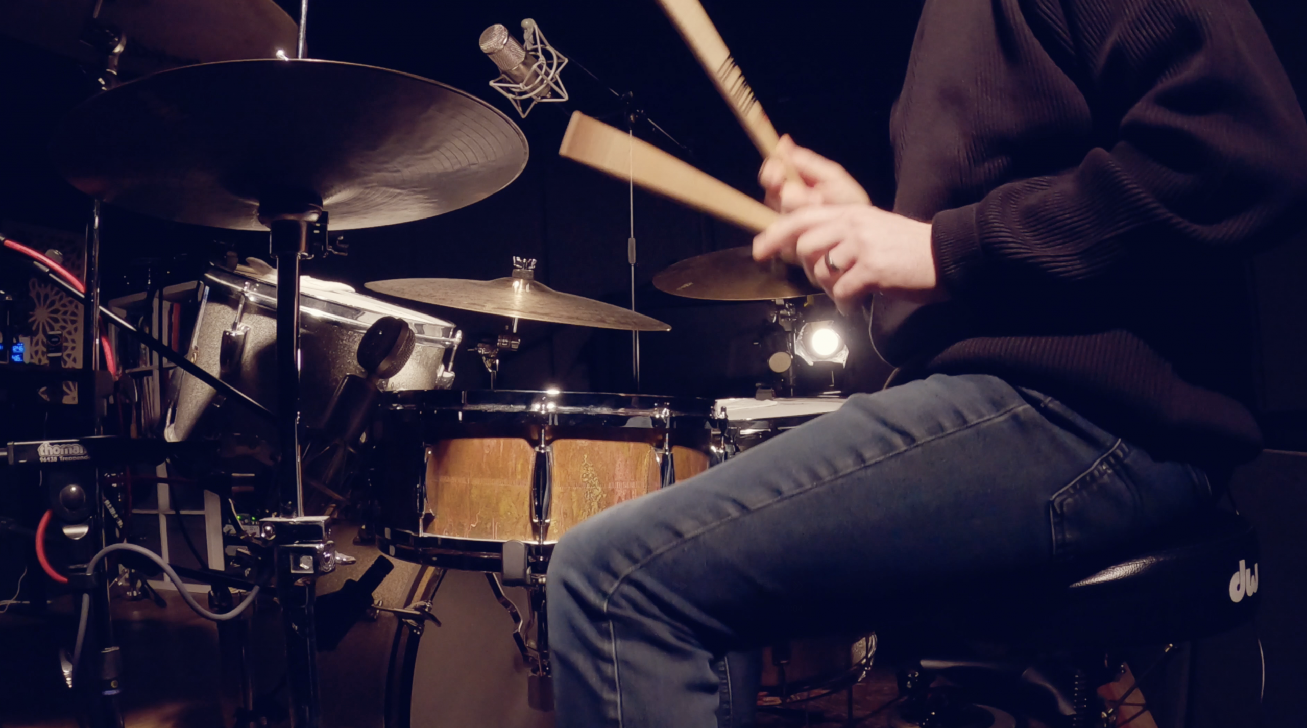 studio drummer for hire at the drums in studio