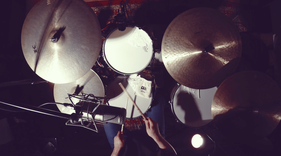remote session drummer playing a funk song